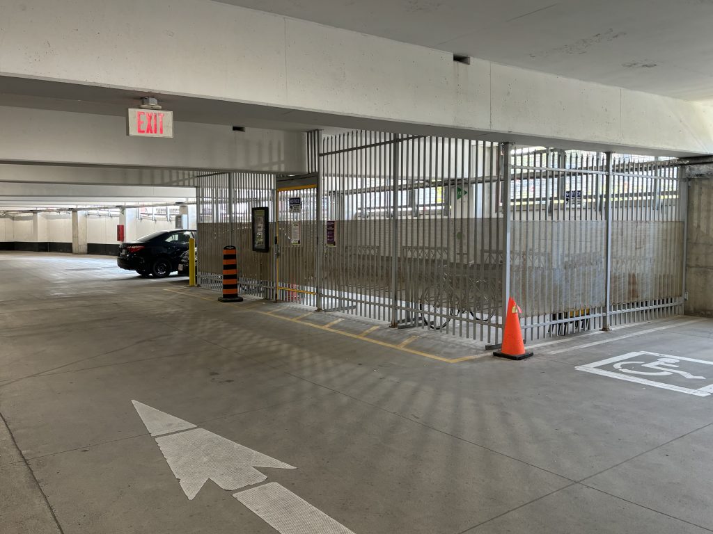 photo of secure bike parking facility in a municipal parking garage in Kitchener, Ontario.